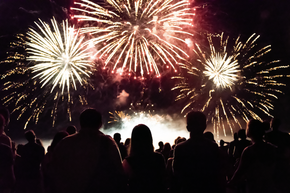 Crowd watching fireworks and celebrating