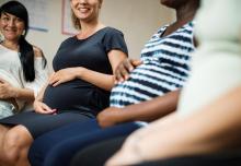 pregnant women sitting in a circle in a class